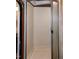This is an image of a well-lit RV shower with a white interior and semi-opaque glass shower door at 142 Blackhawk Dr, Louisburg, NC 27549