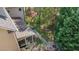 Aerial view of a home's backyard featuring a brick fire pit and patio area at 1512 Piazzo Ct, Apex, NC 27502