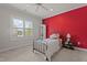 Bright bedroom with neutral carpet, white trim, and large window at 1512 Piazzo Ct, Apex, NC 27502