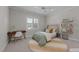 Bedroom featuring a cozy bed, desk, shelves and soft natural lighting at 1512 Piazzo Ct, Apex, NC 27502