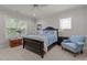 This is a bedroom featuring lots of natural light and a cool blue color scheme at 1512 Piazzo Ct, Apex, NC 27502