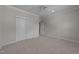 Neutral bedroom featuring plush carpeting, closet and access to an ensuite bathroom at 1512 Piazzo Ct, Apex, NC 27502