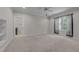 Bright bedroom with neutral carpet, a ceiling fan, and a window offering natural light at 1512 Piazzo Ct, Apex, NC 27502