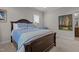 Bedroom with neutral carpet, dark wood furnishings, and light blue accents at 1512 Piazzo Ct, Apex, NC 27502