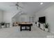 Bonus room featuring a pool table, plants, and decor with neutral carpet at 1512 Piazzo Ct, Apex, NC 27502