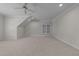 Bonus room featuring neutral carpet, recessed lighting, and a built-in shelving unit at 1512 Piazzo Ct, Apex, NC 27502