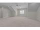 Large bonus room featuring neutral carpet, recessed lighting, and a window for versatile use at 1512 Piazzo Ct, Apex, NC 27502