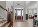 Bright entryway with a staircase and a classic door with sidelights at 1512 Piazzo Ct, Apex, NC 27502