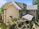 Exterior of home with siding, screened porch, and lush green backyard landscaping at 1512 Piazzo Ct, Apex, NC 27502
