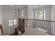 Hallway features elegant dark metal banisters and trim at 1512 Piazzo Ct, Apex, NC 27502