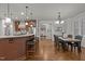 Open kitchen with a breakfast bar, stainless steel appliances and a pantry at 1512 Piazzo Ct, Apex, NC 27502