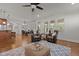 Open-concept living area connects living room, dining area, with hardwood floors and ample light at 1512 Piazzo Ct, Apex, NC 27502