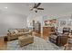 Spacious living room connects to the kitchen with hardwood floors and comfortable seating at 1512 Piazzo Ct, Apex, NC 27502