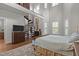 Large bedroom with a spiral staircase to a loft, high ceilings, and shuttered windows at 1512 Piazzo Ct, Apex, NC 27502