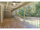 Covered, screened porch with wood floors and a ceiling fan offers a tranquil outdoor living space at 1512 Piazzo Ct, Apex, NC 27502
