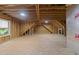 Unfinished bonus room with exposed beams and studs is ready to be customized with your finishing touches at 1512 Piazzo Ct, Apex, NC 27502
