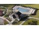 Aerial view of a community center with a pool and plenty of seating and green space at 1572 Bright Coral Trl, Wendell, NC 27591