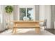 Dining table featuring simple decor and natural light illuminating the inviting dining space at 1572 Bright Coral Trl, Wendell, NC 27591