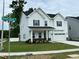 Charming two-story home with a well-maintained lawn and landscaping, located on the corner of Bright Coral at 1572 Bright Coral Trl, Wendell, NC 27591