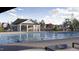 A community pool is flanked by a covered area and playground, offering entertainment for all ages at 1572 Bright Coral Trl, Wendell, NC 27591