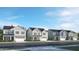 New homes with front-entry garages lining a quiet street, set against a bright blue, cloud-filled sky at 1572 Bright Coral Trl, Wendell, NC 27591