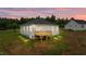 Back of a house with a deck and stairs to a yard; there is also a basement access and vinyl siding at 170 Brookhaven Dr, Spring Hope, NC 27882