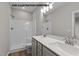 Modern bathroom featuring a double sink vanity with quartz countertop and a separate shower with white tile surround at 170 Brookhaven Dr, Spring Hope, NC 27882