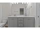 Bathroom features double sink vanity with framed mirror at 170 Brookhaven Dr, Spring Hope, NC 27882