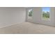 Bright bedroom features two windows and neutral carpeting at 170 Brookhaven Dr, Spring Hope, NC 27882