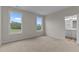 Spacious bedroom features two windows and ensuite bathroom at 170 Brookhaven Dr, Spring Hope, NC 27882