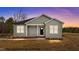 Charming single-story home featuring neutral siding, a covered porch, and a well-maintained front yard at 170 Brookhaven Dr, Spring Hope, NC 27882