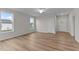 Spacious living room with abundant natural light, ceiling fan, and luxury vinyl plank flooring at 170 Brookhaven Dr, Spring Hope, NC 27882