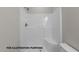 Bright and clean shower with built-in seating, white surround, and modern fixtures at 170 Brookhaven Dr, Spring Hope, NC 27882