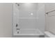Shower features tiled wall with soap and shampoo nook at 170 Brookhaven Dr, Spring Hope, NC 27882