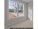 Bright room with a large window providing a view of the outdoors at 170 Brookhaven Dr, Spring Hope, NC 27882
