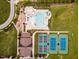 An aerial view of the community amenities, including the pool, clubhouse, and tennis courts at 1914 Woodsdale Dr, Durham, NC 27703