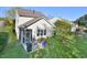 Aerial view of the backyard featuring patio, screened porch, and lush greenery at 1914 Woodsdale Dr, Durham, NC 27703
