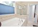 The main bath features a soaking tub and separate glass shower at 1914 Woodsdale Dr, Durham, NC 27703