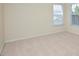 Bright bedroom with neutral carpet and natural light from the window at 1914 Woodsdale Dr, Durham, NC 27703