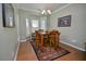 Bright dining room features natural light, a chandelier, and seating for four at 1914 Woodsdale Dr, Durham, NC 27703
