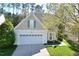 Traditional two-story home with a well-maintained lawn and attached two car garage at 1914 Woodsdale Dr, Durham, NC 27703