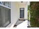 A charming front door with sidelight and transom window offers a warm welcome at 1914 Woodsdale Dr, Durham, NC 27703