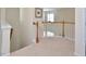 Spacious hallway with carpet flooring and a view of the staircase below at 1914 Woodsdale Dr, Durham, NC 27703