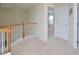 Second floor hallway leading to bedrooms, with white trim and neutral walls at 1914 Woodsdale Dr, Durham, NC 27703