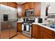 Modern kitchen featuring stainless steel appliances, plentiful counter space, and ample lighting at 1914 Woodsdale Dr, Durham, NC 27703