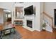 Inviting living room featuring a fireplace, hardwood floors, and an open layout to the kitchen at 1914 Woodsdale Dr, Durham, NC 27703