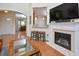 Bright and airy living room with an open layout, fireplace, and seamless flow into the dining area at 1914 Woodsdale Dr, Durham, NC 27703