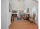 Bright living room features high ceilings, hardwood floors, and lots of natural light at 1914 Woodsdale Dr, Durham, NC 27703