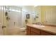 Bathroom featuring a shower-tub combo, wood vanity, framed mirror, and neutral walls at 201 Blithe Pl, Morrisville, NC 27560