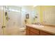 Bathroom featuring a shower-tub combo, wood vanity, framed mirror, and neutral walls at 201 Blithe Pl, Morrisville, NC 27560